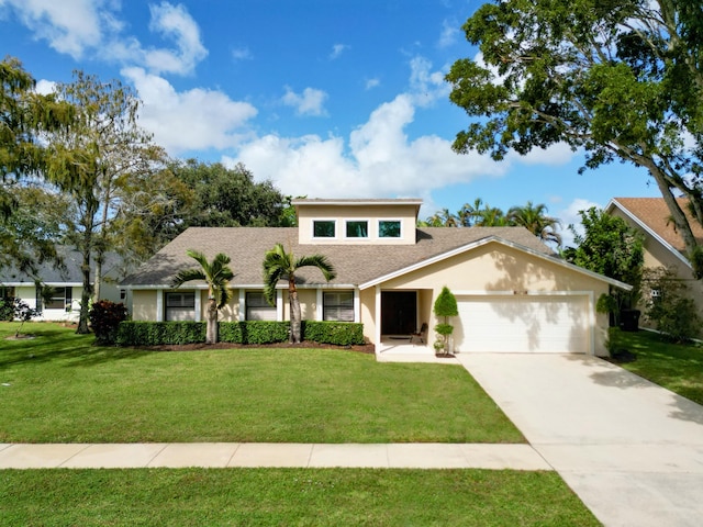 view of front facade featuring a garage and a front lawn