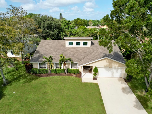 view of front facade featuring a garage and a front lawn