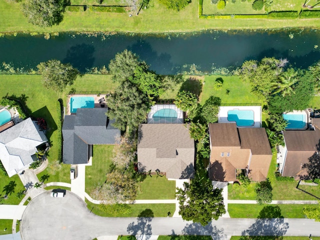 birds eye view of property featuring a water view