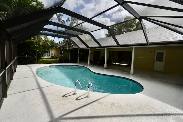 view of pool featuring a patio and a lanai