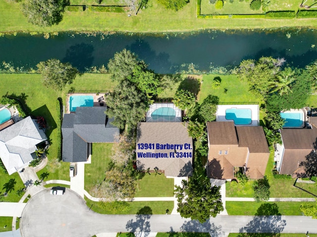 birds eye view of property with a water view