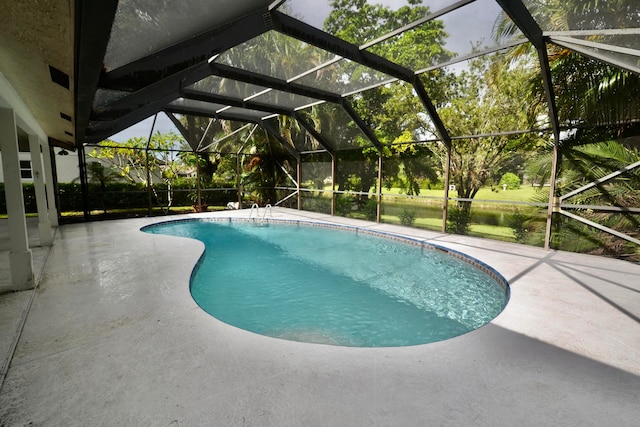 view of pool featuring a patio and a lanai