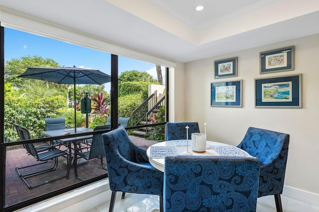 tiled dining room with crown molding