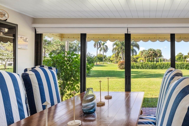 doorway to outside with wooden ceiling