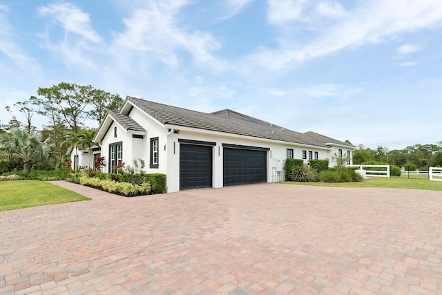 view of side of home with a garage