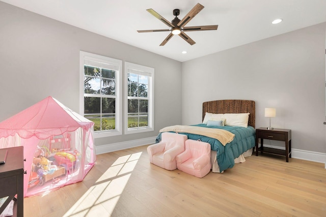 bedroom featuring ceiling fan and hardwood / wood-style flooring