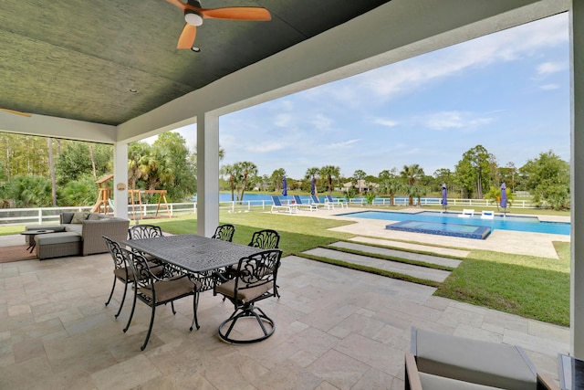 view of patio / terrace featuring a playground and ceiling fan