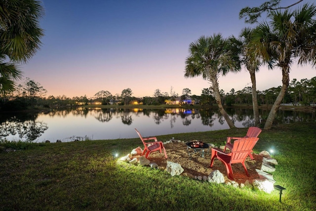 view of water feature with a fire pit