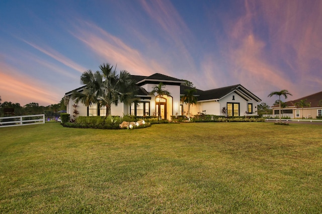 mediterranean / spanish-style house featuring a yard