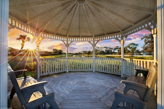 deck at dusk with a gazebo