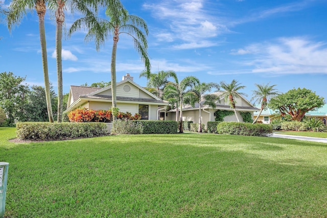 single story home featuring a front yard