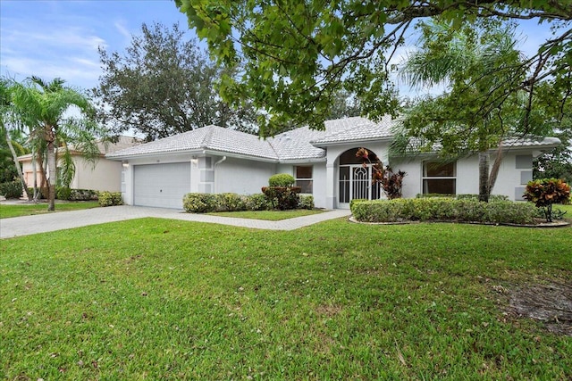 view of front of house featuring a garage and a front yard