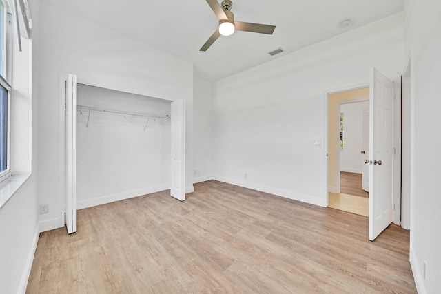 unfurnished bedroom with a closet, ceiling fan, and light hardwood / wood-style floors