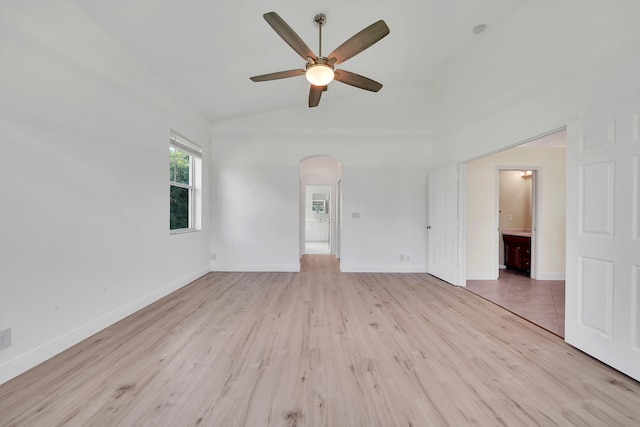 unfurnished living room featuring light hardwood / wood-style flooring, lofted ceiling, and ceiling fan