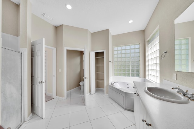 full bathroom featuring toilet, tile patterned floors, a textured ceiling, and plus walk in shower