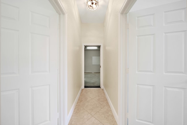 hall featuring light tile patterned flooring