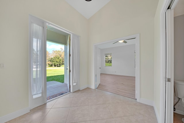 entryway featuring light hardwood / wood-style floors and high vaulted ceiling