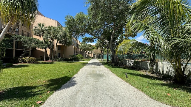 view of property's community with a lawn