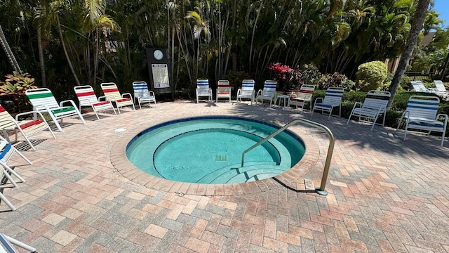 view of pool with a patio area and a community hot tub