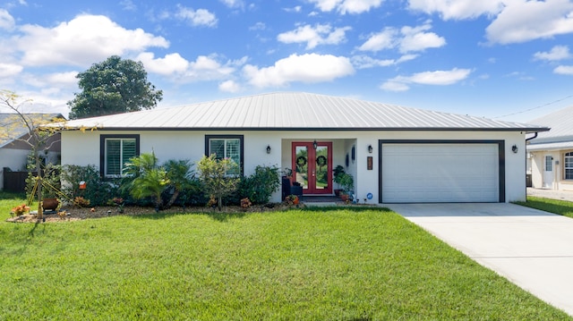 single story home with a garage and a front lawn