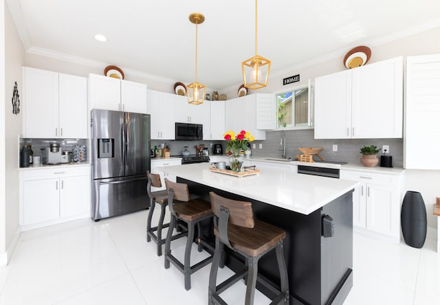 kitchen with hanging light fixtures, a kitchen island, stainless steel fridge with ice dispenser, white cabinetry, and a kitchen bar