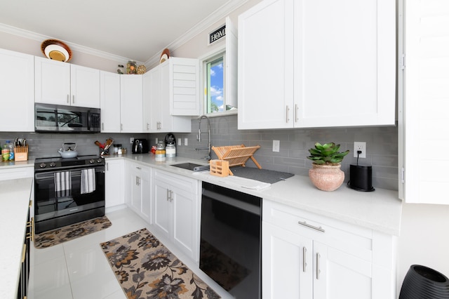 kitchen featuring ornamental molding, black appliances, a sink, and backsplash