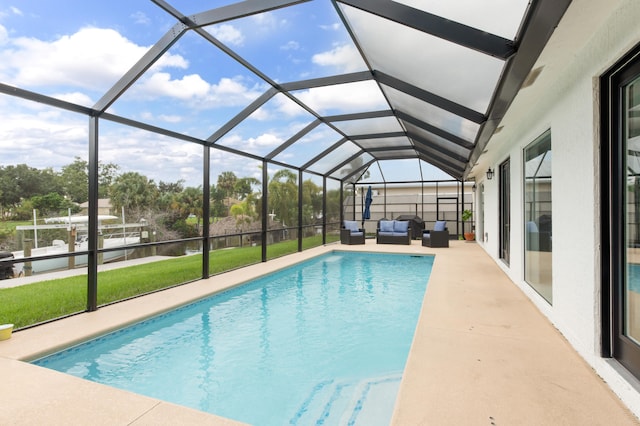 view of pool with a patio, a lanai, and a water view