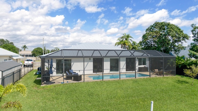 back of property featuring a patio, glass enclosure, and a lawn