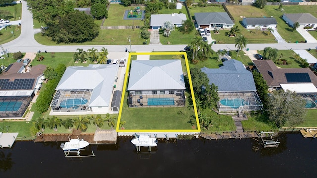aerial view featuring a water view and a residential view