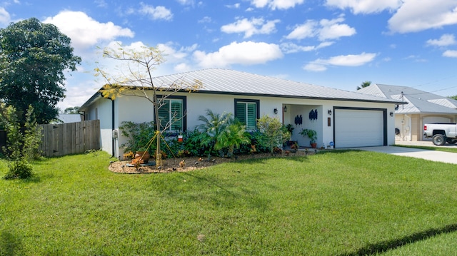 ranch-style house featuring a front yard and a garage