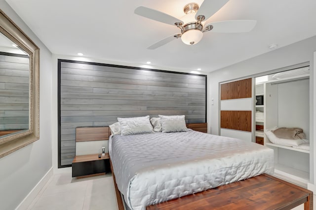 bedroom featuring ceiling fan and light tile patterned flooring