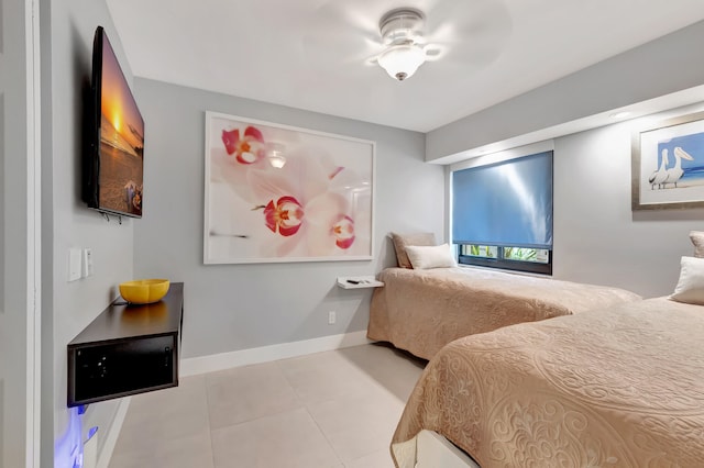 bedroom featuring ceiling fan and light tile patterned floors