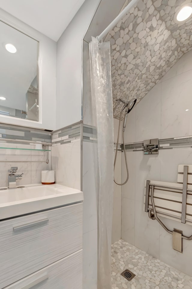 bathroom featuring vanity, tile walls, tile patterned floors, and a shower with shower curtain