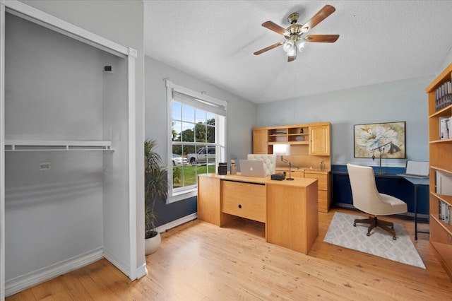 office area with light hardwood / wood-style flooring, a textured ceiling, and ceiling fan