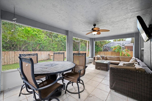 view of patio with an outdoor living space and ceiling fan