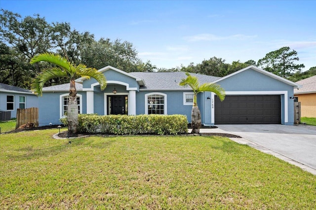 single story home with cooling unit, a garage, and a front lawn