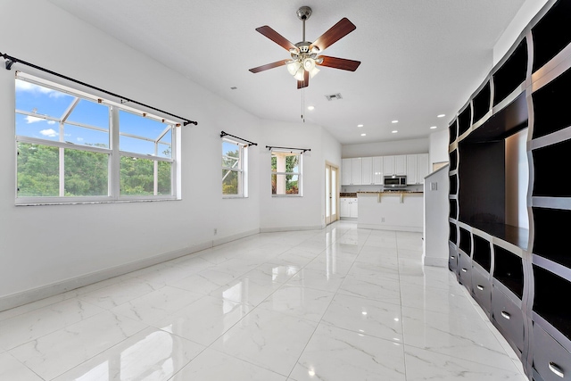 interior space featuring ceiling fan