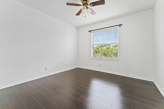 unfurnished room featuring ceiling fan, dark hardwood / wood-style floors, and a textured ceiling