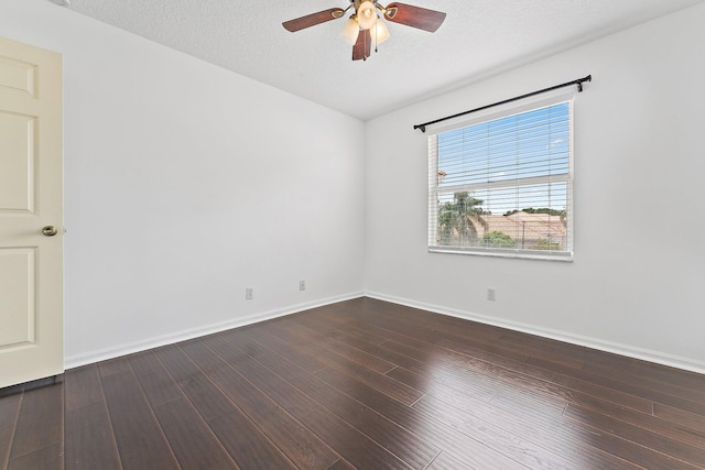 unfurnished room with ceiling fan, dark hardwood / wood-style floors, and a textured ceiling