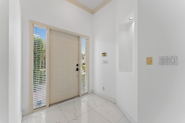 entryway featuring crown molding