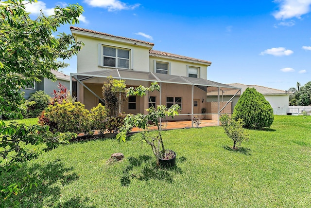 back of property featuring a lawn and a patio area