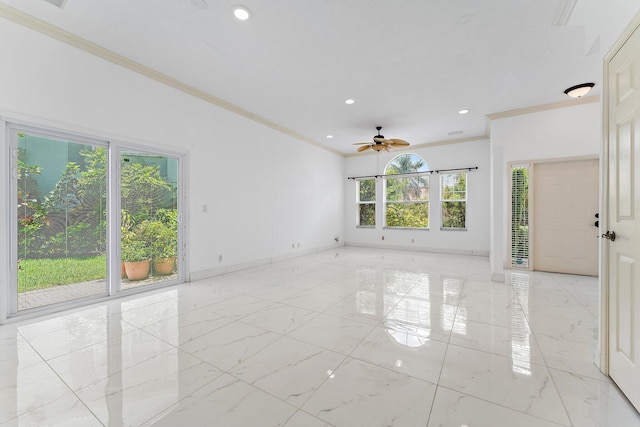 unfurnished room featuring ceiling fan and crown molding