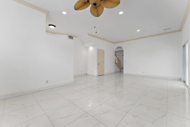 unfurnished room featuring ceiling fan and crown molding