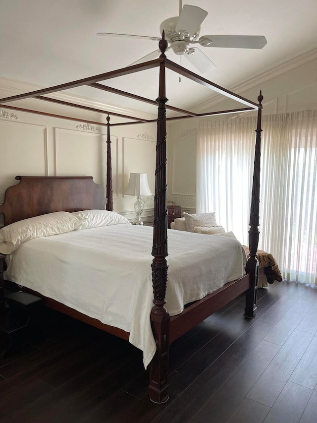 bedroom featuring hardwood / wood-style flooring, ceiling fan, and crown molding