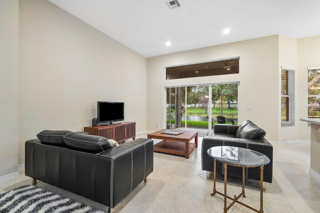 9587 Positano Way, Lake Worth, FL 33467 - living area featuring recessed lighting, baseboards, and a high ceiling