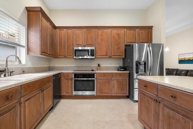 kitchen with sink and black appliances