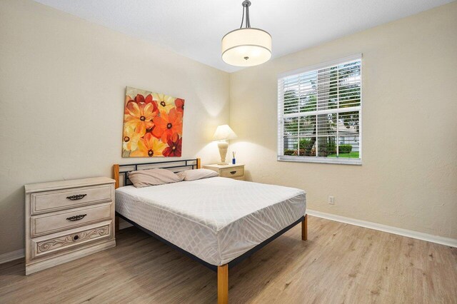 bedroom featuring light wood-type flooring