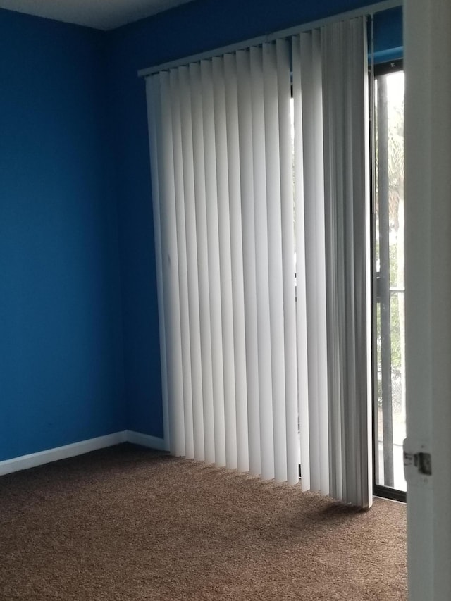 empty room with carpet flooring