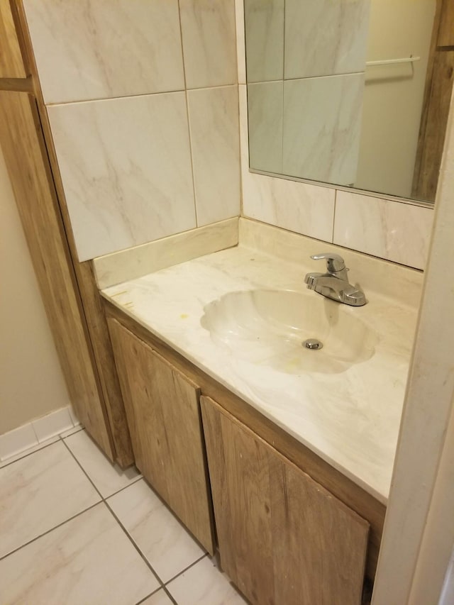 bathroom with tile patterned flooring and vanity