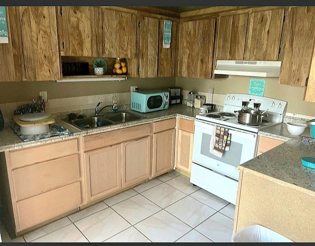 kitchen featuring white appliances and sink